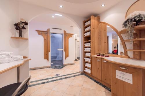 a large kitchen with wooden cabinets and a counter top at Hotel Vista Allegra in Ischgl