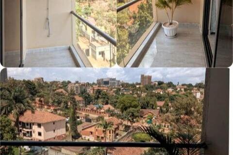 a view of a city from a balcony of a building at Feel at Home in Kampala