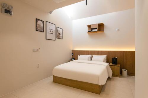 Postel nebo postele na pokoji v ubytování 양주 무인텔 호텔그리다 Hotel Grida