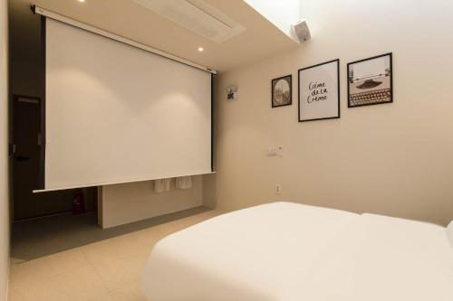Postel nebo postele na pokoji v ubytování 양주 무인텔 호텔그리다 Hotel Grida