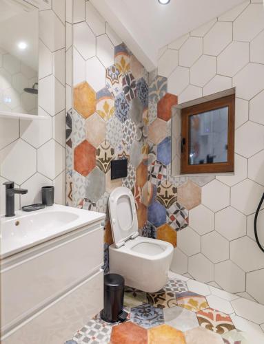 a bathroom with a toilet and a sink at Mountain studio Govedartsi in Govedartsi
