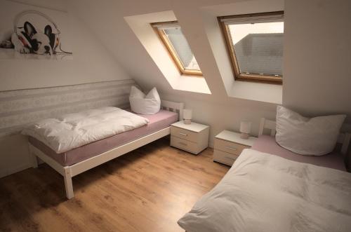 Postel nebo postele na pokoji v ubytování Zum Käutzchen 120qm Ferienhaus 8 Personen 4 Schlafzimmer