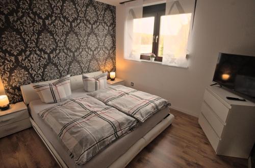 Postel nebo postele na pokoji v ubytování Zum Käutzchen 120qm Ferienhaus 8 Personen 4 Schlafzimmer