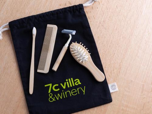 a black towel with toothbrushes and a comb on it at 7c villa and winery in Fujikawaguchiko