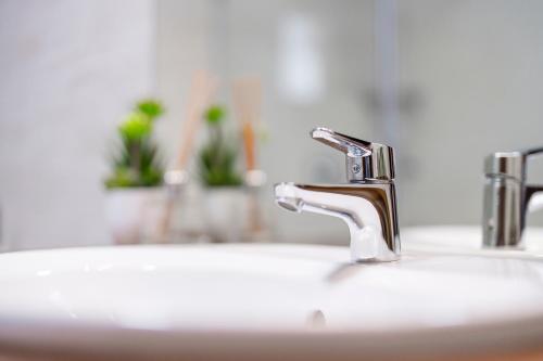 a bathroom sink with a faucet on top of it at Balea Teleferic in Cîrţişoara
