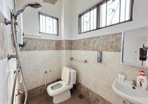 a bathroom with a toilet and a sink at Bangi BungalowStay in Kajang