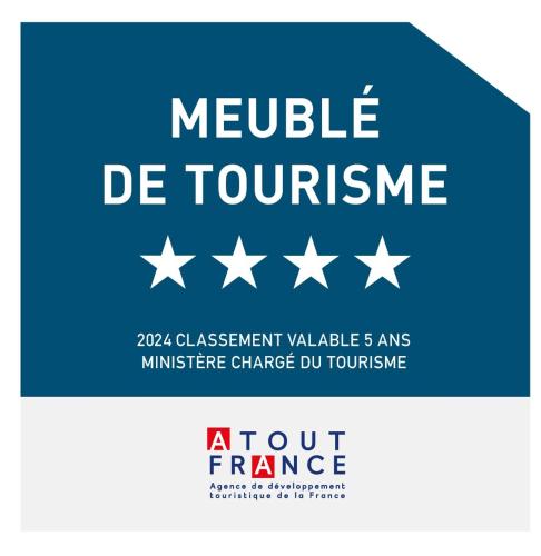 a blue sign with white stars and the text module de tourism at Bungalows Ti Lodge Martinique - près de la plage avec jacuzzi privé in Sainte-Luce