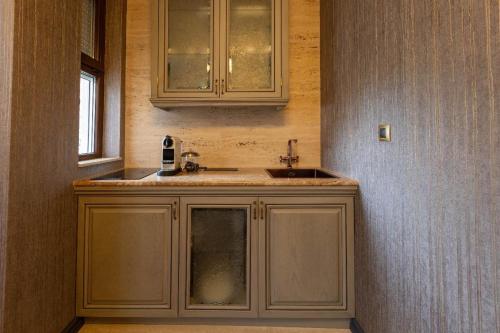 a kitchen with a sink and a window at Downtown Residence in Podgorica