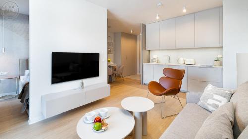 a living room with a couch and a table at Apartamenty Good Time - Belle View - Centrum in Szklarska Poręba