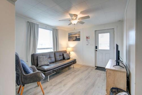 a living room with a couch and a television at Pelican's Perch 1-Bed by the Sea w fireplace in Grayland