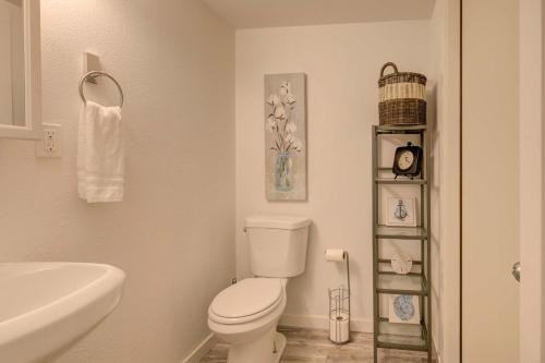 a bathroom with a white toilet and a sink at Pelican's Perch 1-Bed by the Sea w fireplace in Grayland