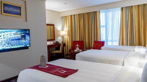Postel nebo postele na pokoji v ubytování فندق الصفوة البرج الثالث Al Safwah Hotel Third Tower 3