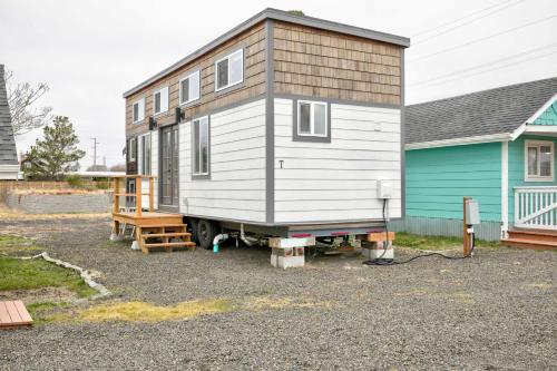 a tiny house sitting on the back of a truck at Cozy Loft Tiny House by Ocean Spray Beach in Grayland