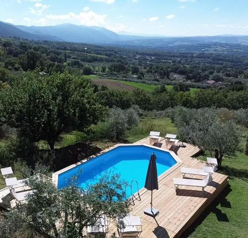 an image of a swimming pool in a yard at Casa Zampani in Massa Martana