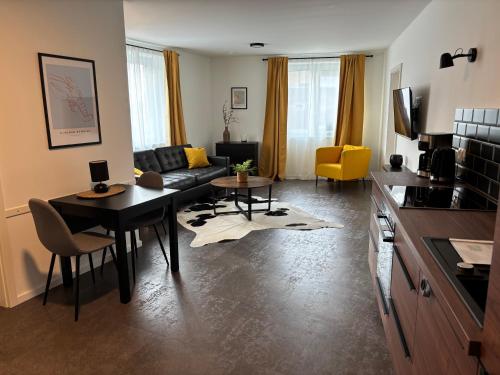a living room with a couch and a table at Ferienwohnung-Domziegelhof in Schleswig