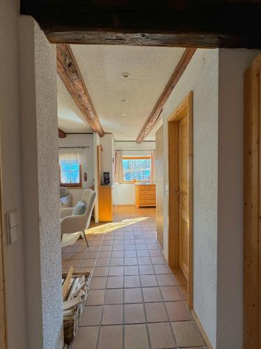 a hallway of a house with a living room at Landhaus Krappinger in Bad Kleinkirchheim