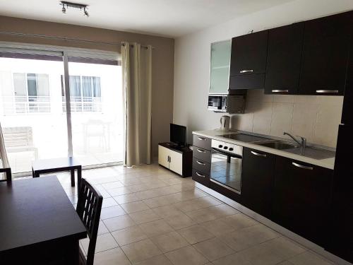Kuchyň nebo kuchyňský kout v ubytování Duplex Avalon