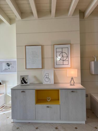 a room with a desk with a lamp on it at Casa degli Angeli in Casalmoro