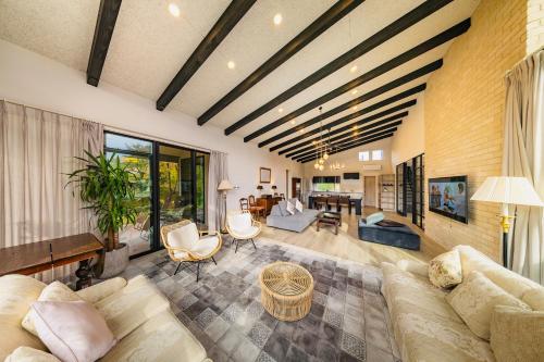 a living room with a couch and a table at Hakuba Jolie Maison by Jade Group in Hakuba
