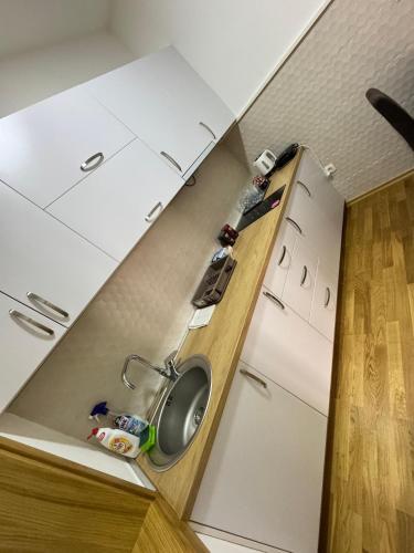 a small kitchen with a sink in the ceiling at Old House Bozovic in Nikšić