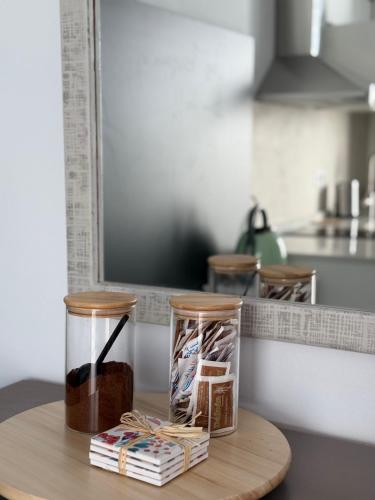 a wooden table with two jars on top of a kitchen counter at Casa del Sol B in Arrieta