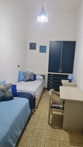 Postel nebo postele na pokoji v ubytování Casa Vacanze Nonna Tetta