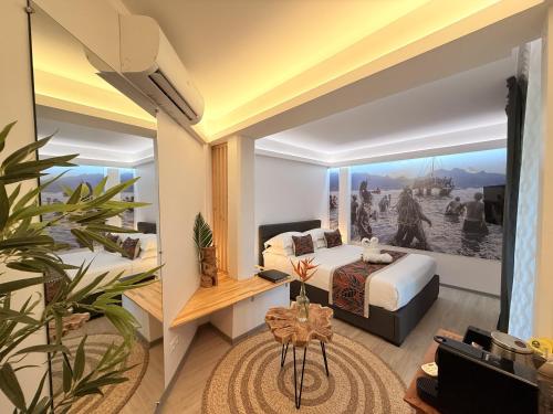 a hotel room with a bed and a large window at Ononui Airport Studio in Faaa