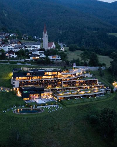 an aerial view of a large building with lights at Santre dolomythic home in Bressanone