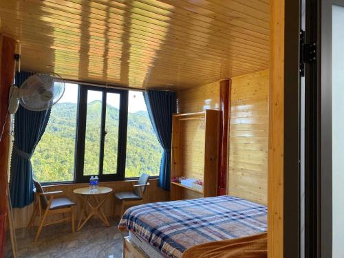 Ένα ή περισσότερα κρεβάτια σε δωμάτιο στο Săn Mây Homestay and Coffee Măng Đen