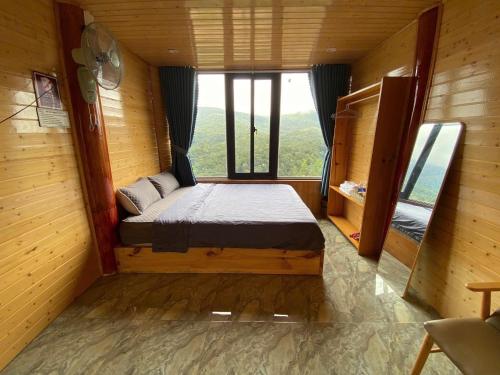 Ένα ή περισσότερα κρεβάτια σε δωμάτιο στο Săn Mây Homestay and Coffee Măng Đen