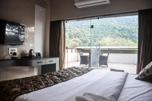 Postel nebo postele na pokoji v ubytování Hotel Hello Jeypore