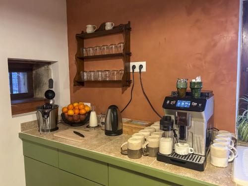 a kitchen with a coffee maker on a counter at Maison Belles Pierres in Montagny-lès-Beaune