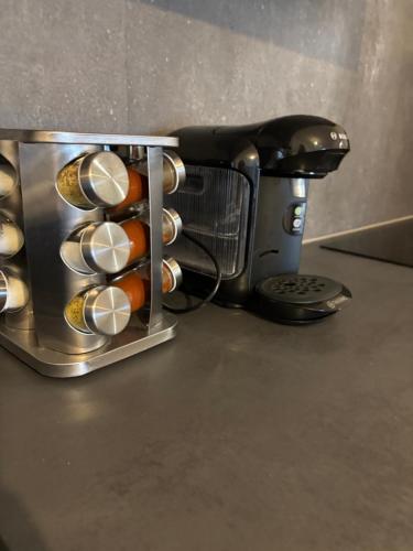 a coffee maker sitting on top of a counter at Moderne Wohnung in Linz