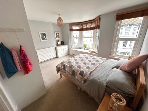 a bedroom with a bed and a window at Hanover House in Brighton & Hove