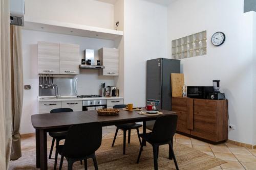 a kitchen with a table and chairs and a refrigerator at Ca'Mea 2 Citra 008031-LT1474 in Imperia