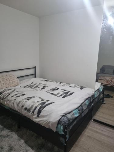 Ένα ή περισσότερα κρεβάτια σε δωμάτιο στο Nice stay close to paris