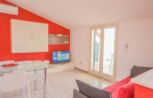 Televisyen dan/atau pusat hiburan di Case Vacanze Mare Nostrum - Villas in front of the Beach with Pool