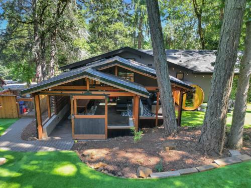 a house with a gazebo in a yard at Eugene Evergreen Escape By Leschaletsstays in Eugene