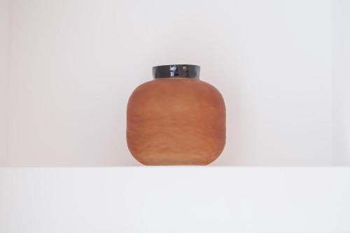 a brown bottle sitting on top of a shelf at 5 Stockland Street in Caerphilly
