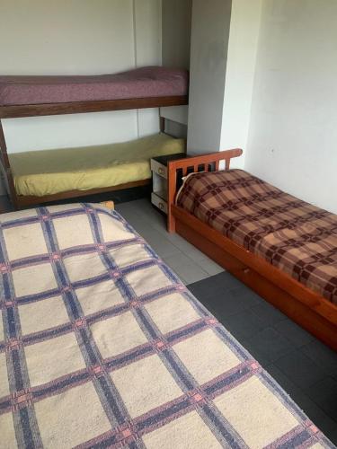 a room with two bunk beds and a rug at Casa Bereber in Santa Clara del Mar