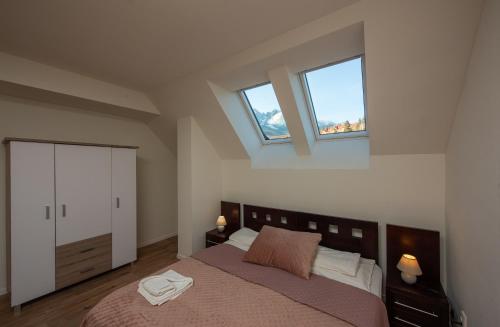 Una cama o camas en una habitación de Hotel Tulipan