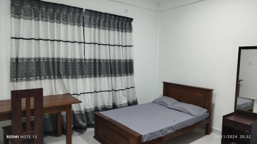 Postel nebo postele na pokoji v ubytování Mihitha Resort