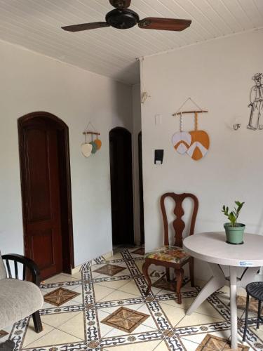 a living room with a table and chairs at Casa para COP 30 in Belém