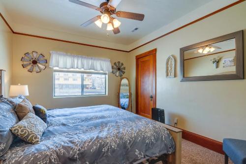 a bedroom with a bed and a ceiling fan at Red Rock Rentals in Cannonville