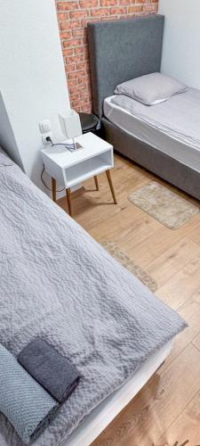 Postel nebo postele na pokoji v ubytování Apartman Marinero