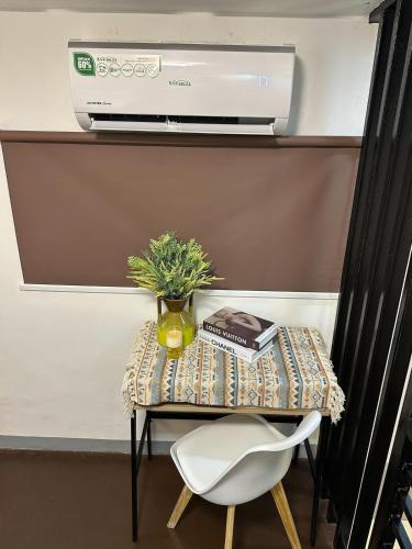 a small table with a chair and a printer at The Loft 2 in Cabanatuan