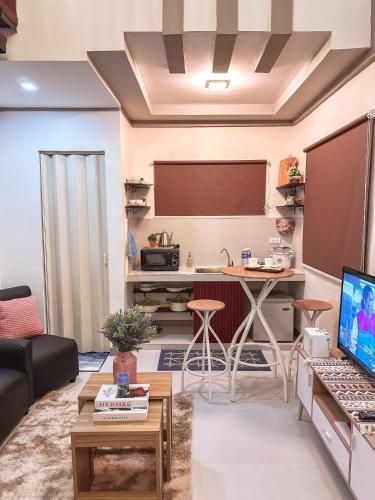 a living room with a couch and a table at The Loft 2 in Cabanatuan