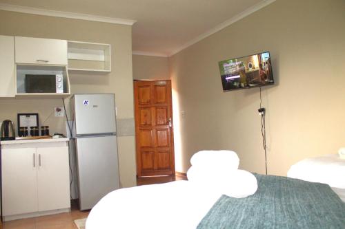Postel nebo postele na pokoji v ubytování Ador Lodges