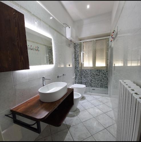 a bathroom with a tub and a toilet and a sink at Casa Piero in Lecce
