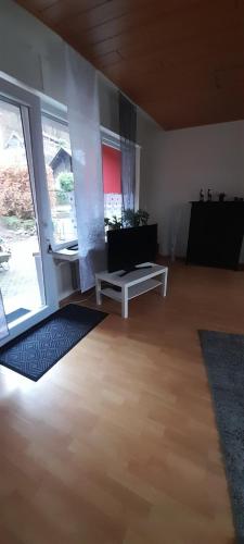 a living room with a couch and a table at Wunderschönes Sauerland in Plettenberg